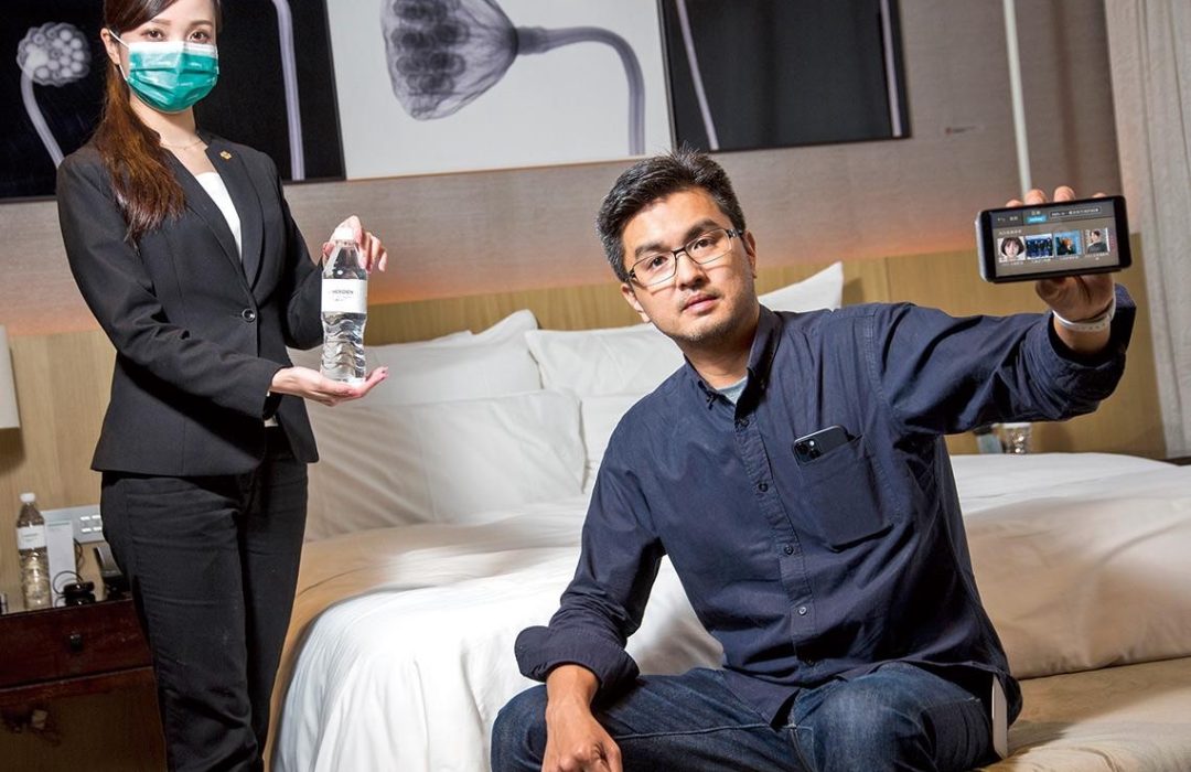 CEO and hotel staff showing Aiello Assistant in hotel room